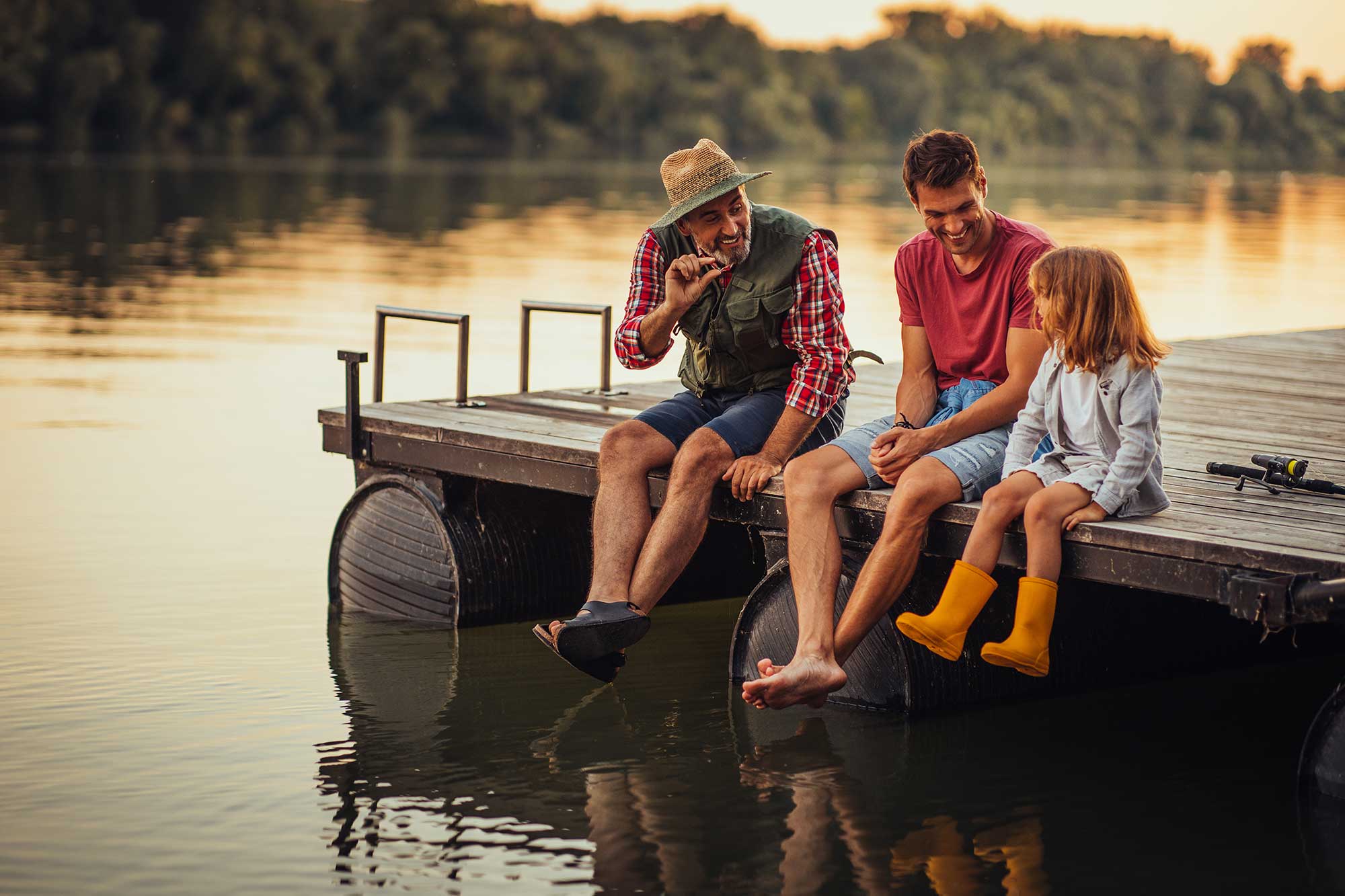 Family sitting on a dock. 